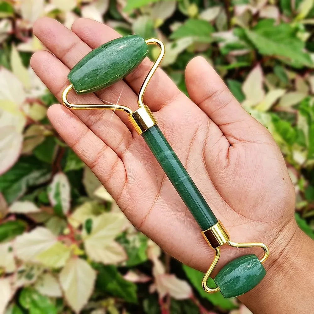 Pure jade roller with ergonomic handle, designed for a comfortable grip and effective facial massage.